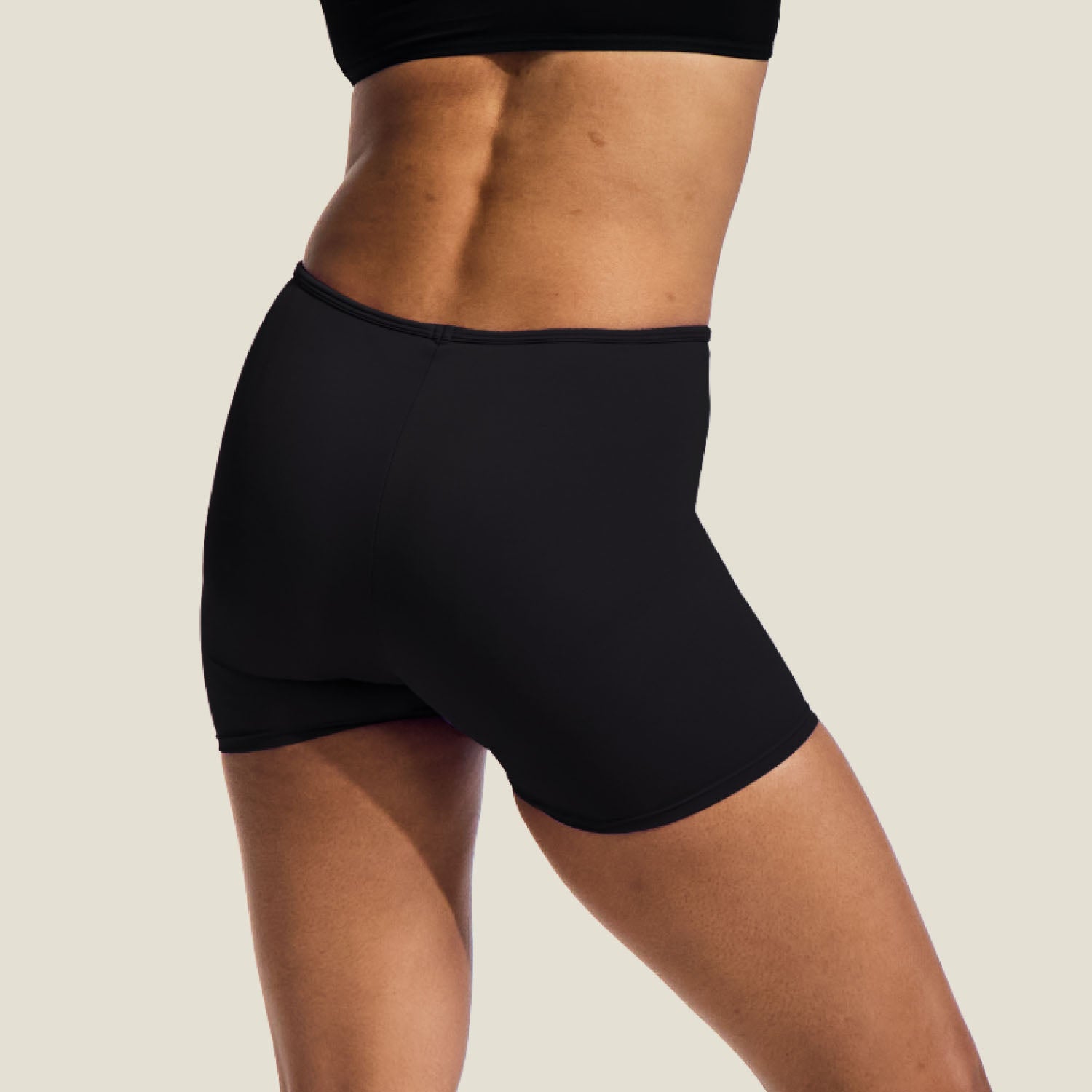 Rear view of WUKA Teen Swim Shorts highlighting full-coverage design and discreet, absorbent protection for medium menstrual flow.