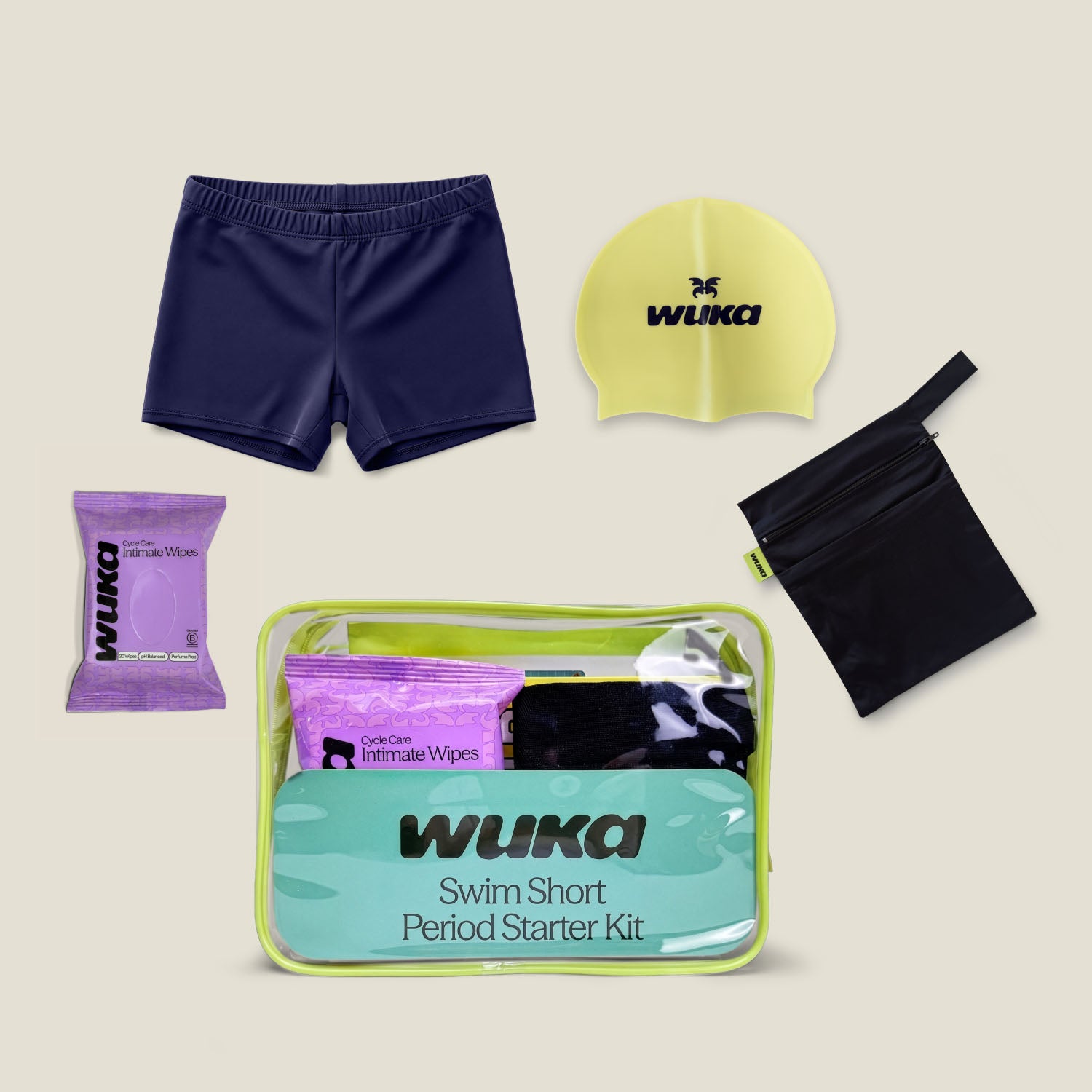 Women’s period-proof navy swim shorts starter kit with waterproof bag, swim cap and intimate wipes by WUKA
